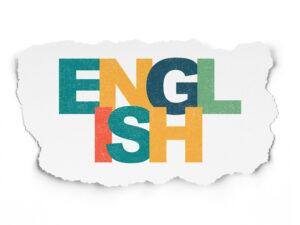 Education concept: English on Torn Paper background